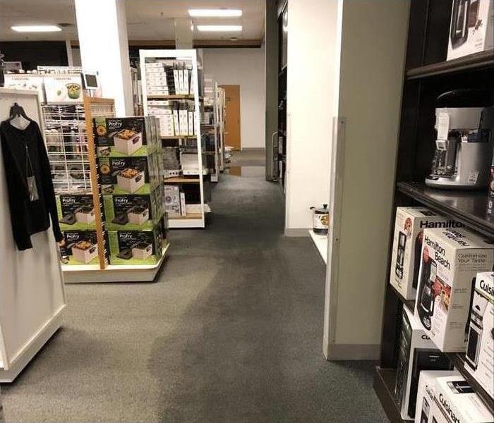 Wet carpet in the kitchen section of a department store