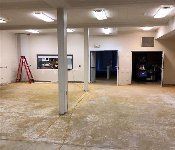 Empty multi-purpose room with carpet removed