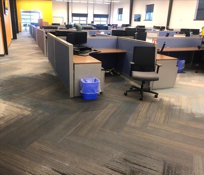 Large commercial office building with multiple cubicles with wet carpet