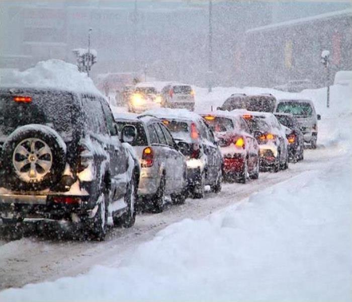 Cars lined up during a winter storm